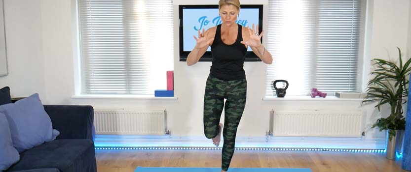 Improving balance is another benefit of pilates. This image shows Jo Tuffrey instructing a class.