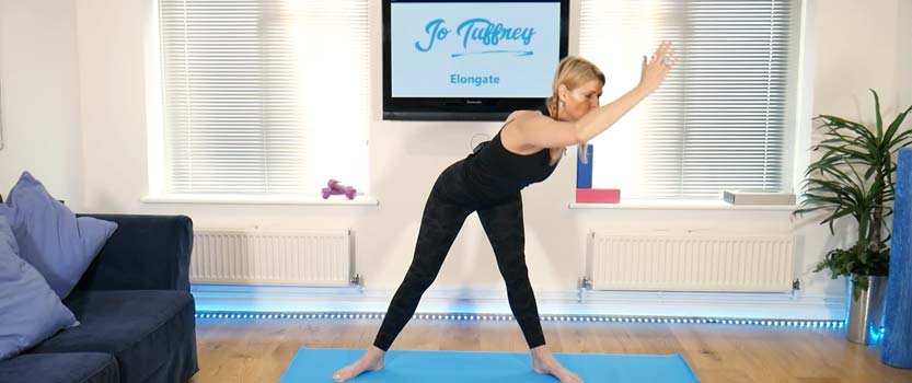 A photo showing a pilates class to improve posture through stretching