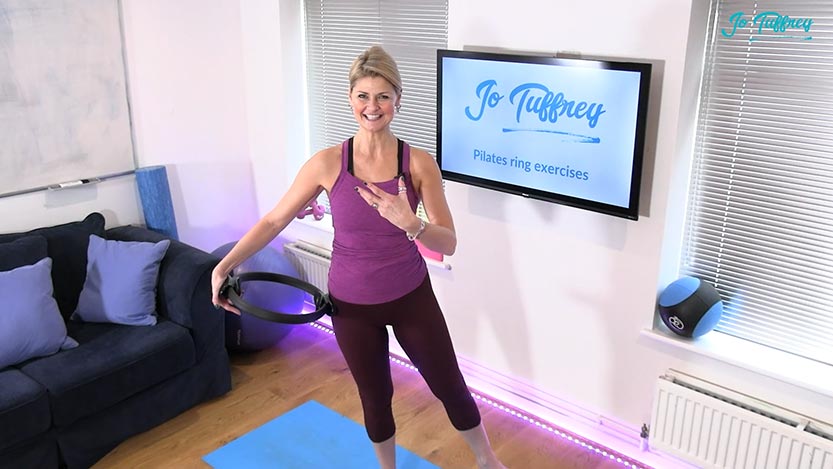 Jo demonstrating a side press with a pilates ring